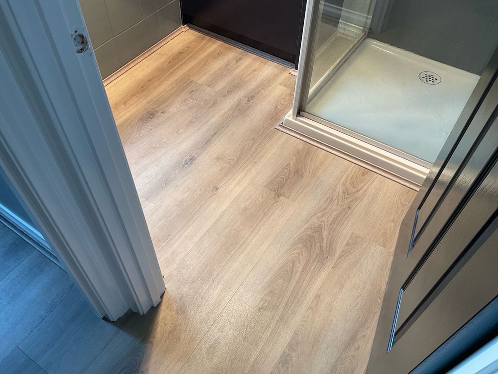 Timber floorboards laid through a wet area with no water stops, found during a pre-purchase inspection in Narre Warren South