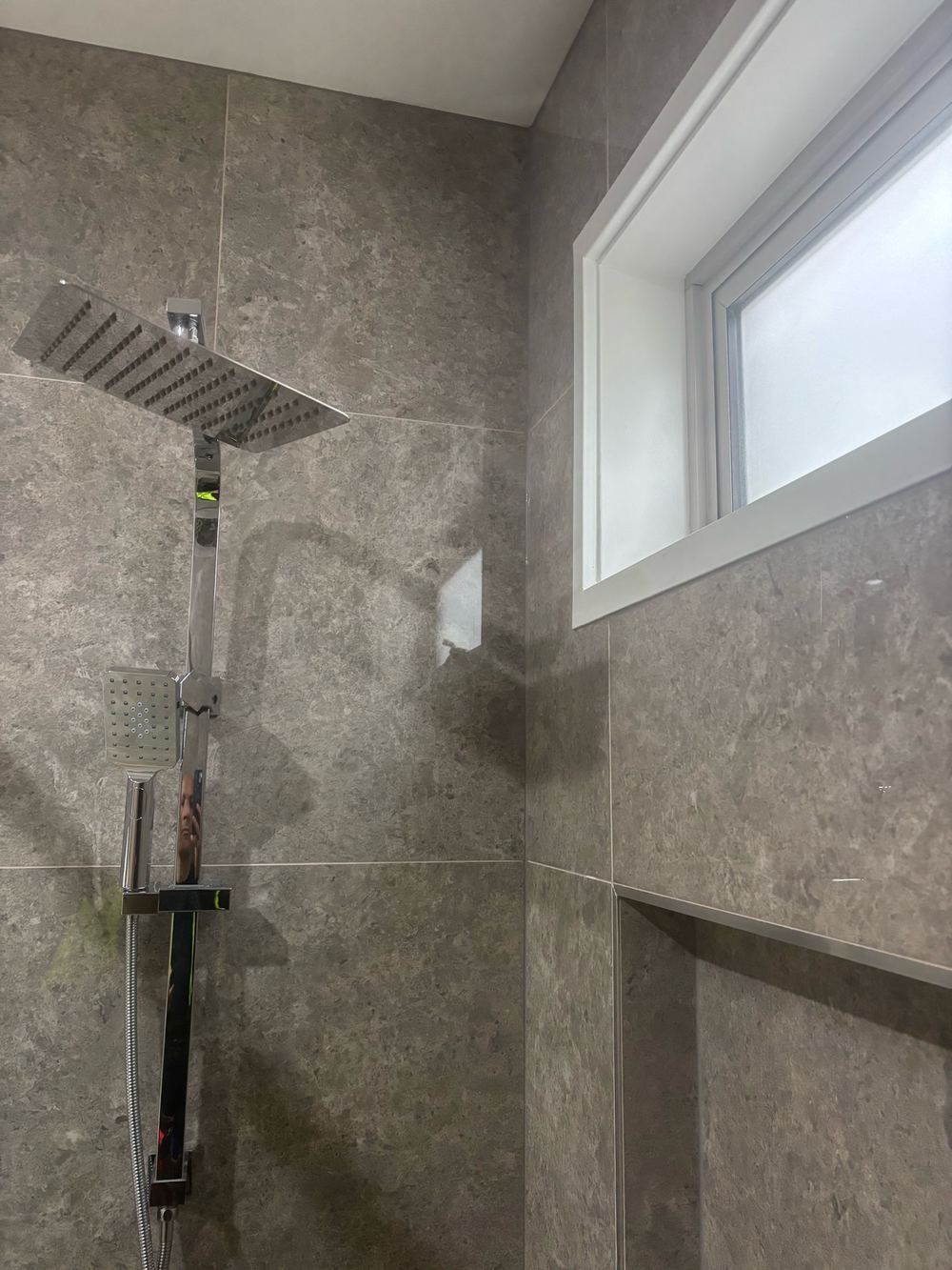 MDF architrave fitted inside a shower area, where it will swell and fail, found during a waterproofing inspection in Clyde North